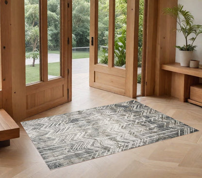 9' X 13' Dark Gray And Ivory Chevron Area Rug