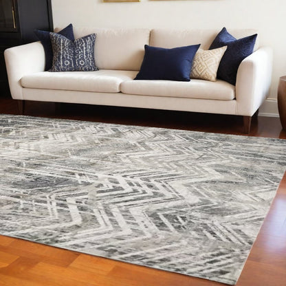 9' X 13' Dark Gray And Ivory Chevron Area Rug