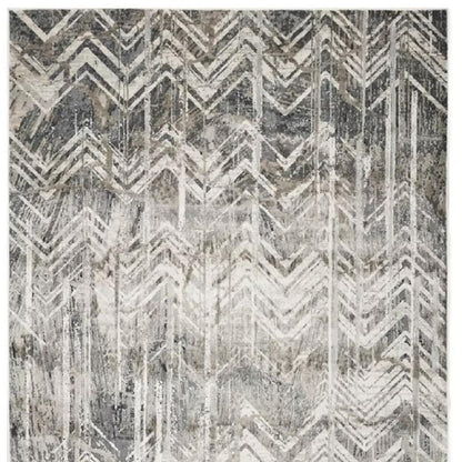 9' X 13' Dark Gray And Ivory Chevron Area Rug