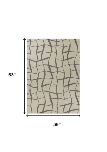 3' X 5' Ivory Abstract Shag Area Rug