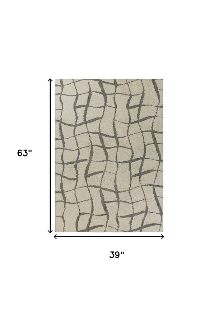 3' X 5' Ivory And Dark Gray Abstract Shag Area Rug