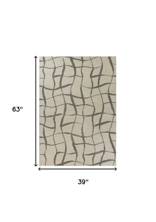 3' X 5' Ivory And Dark Gray Abstract Shag Area Rug