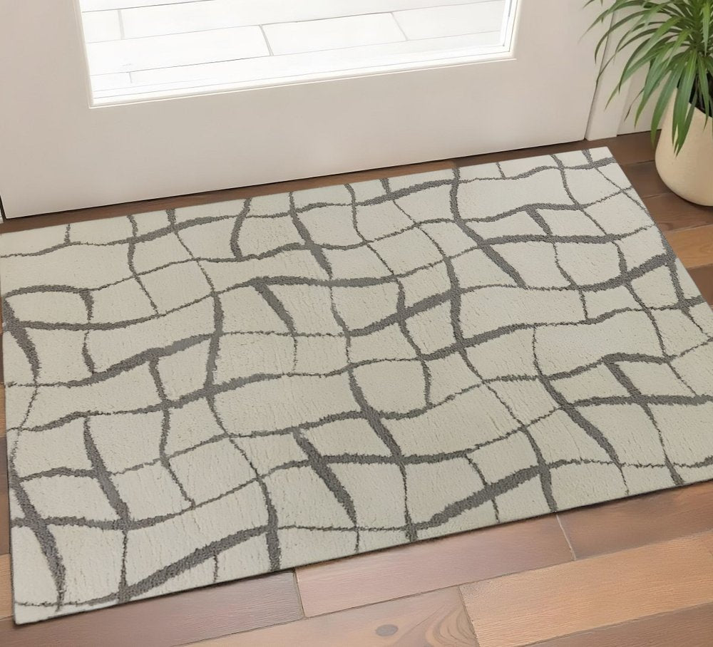 3' X 5' Ivory And Dark Gray Abstract Shag Area Rug