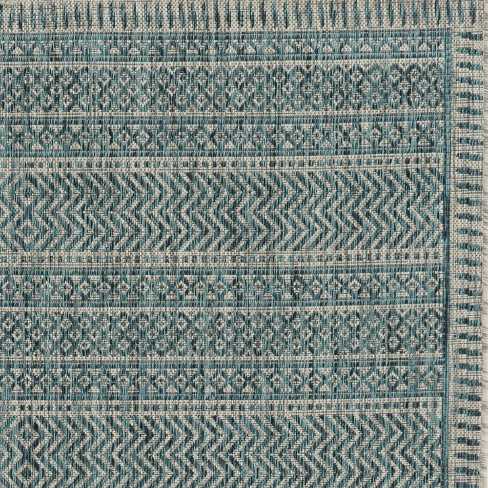 8' X 11' Teal And Beige Geometric Area Rug