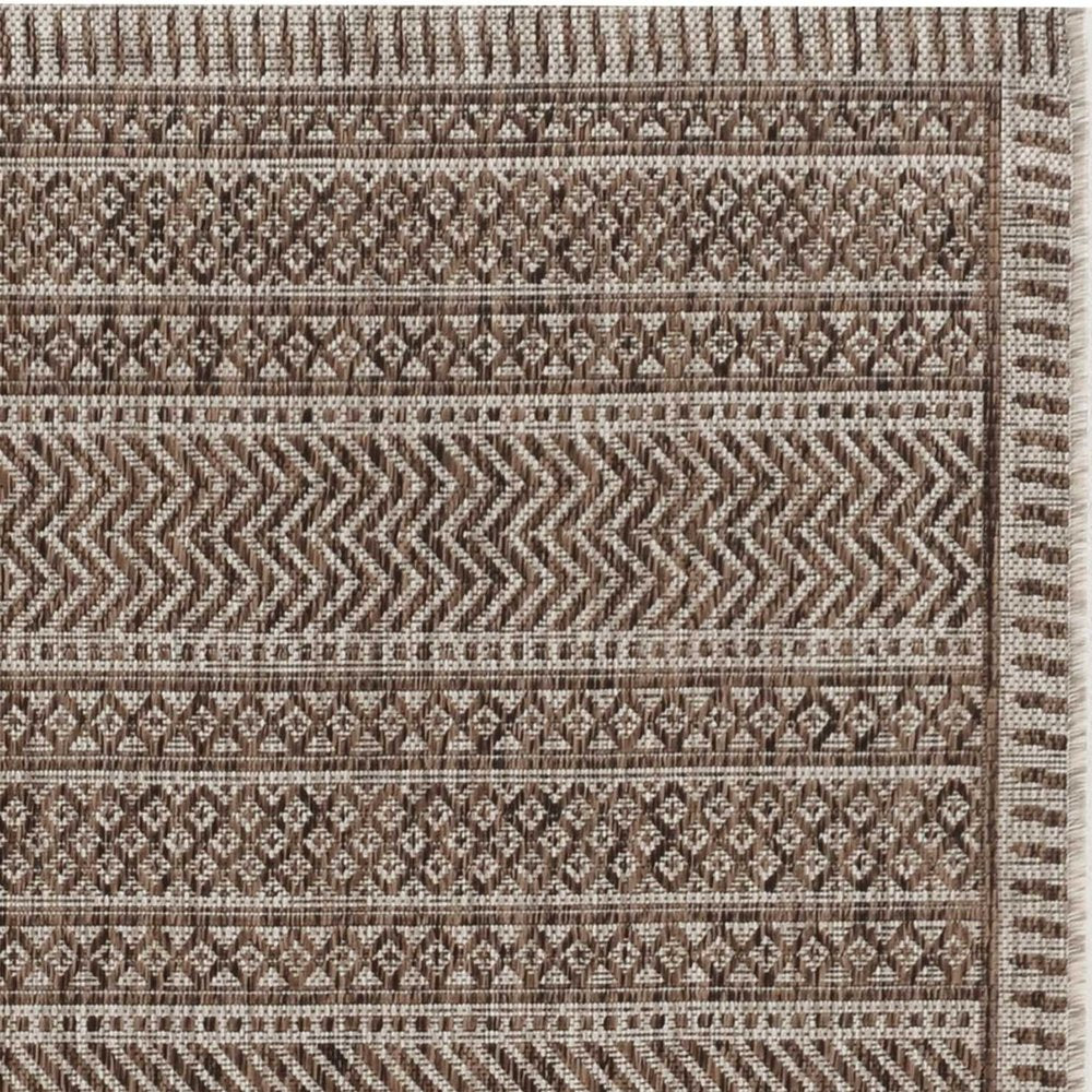 8' X 11' Brown And Ivory Geometric Area Rug