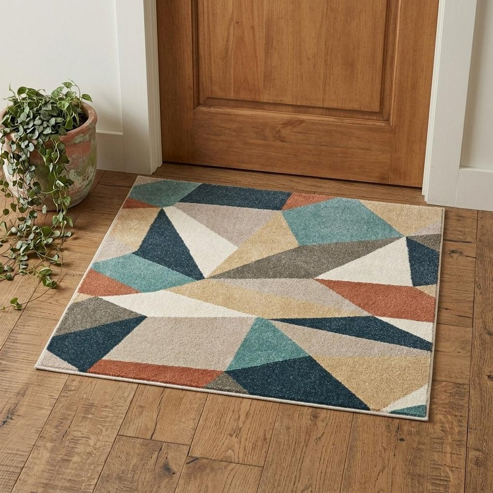 7' X 10' Blue Green And Beige Abstract Geometric Area Rug
