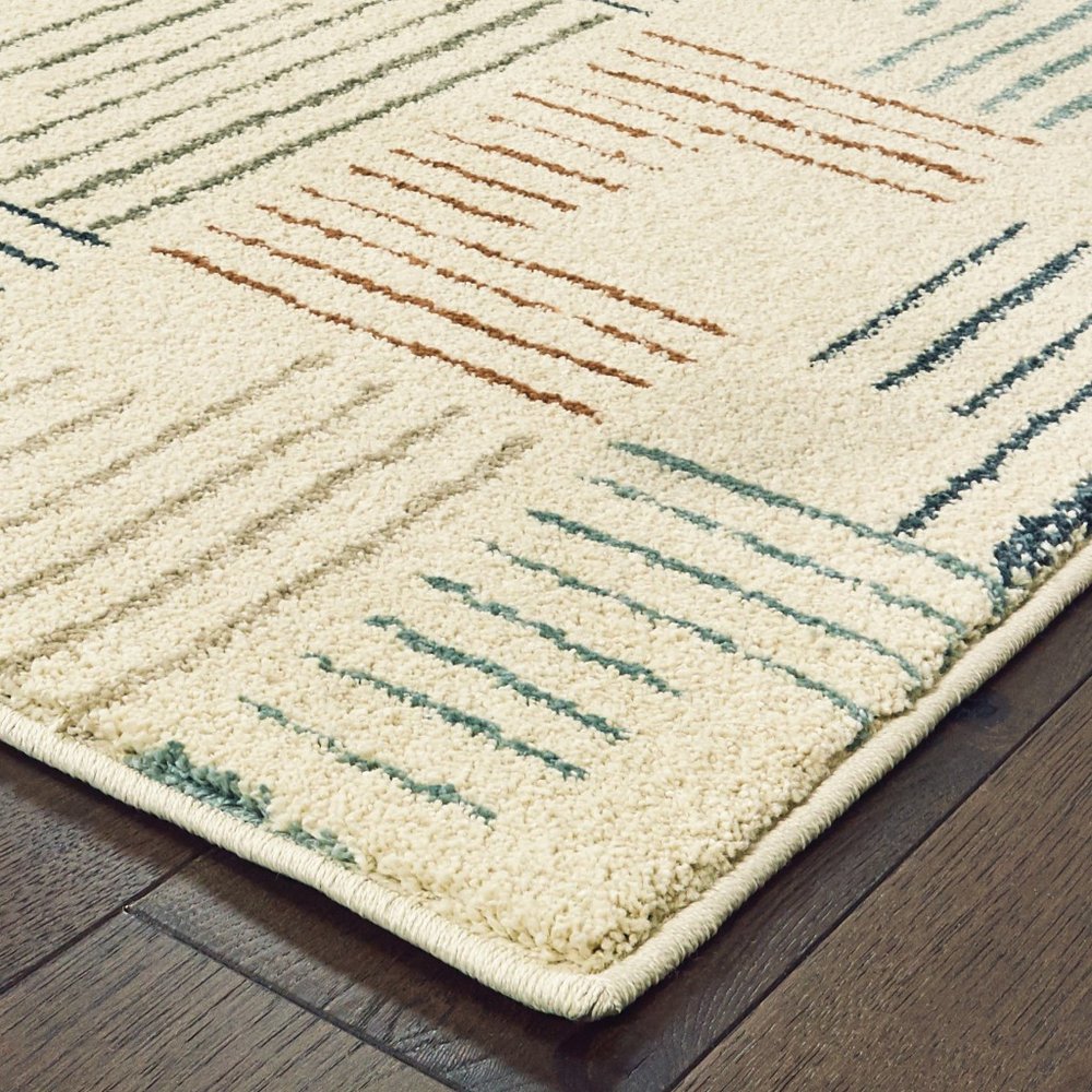 6' X 9' Ivory Blue And Red Geometric Area Rug