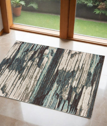6' X 9' Ivory Blue And Gray Abstract Area Rug