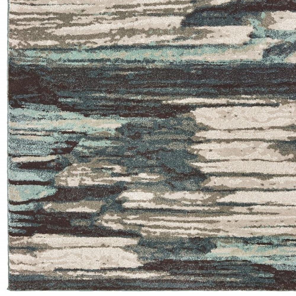 6' X 9' Ivory Blue And Gray Abstract Area Rug