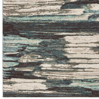 6' X 9' Ivory Blue And Gray Abstract Area Rug