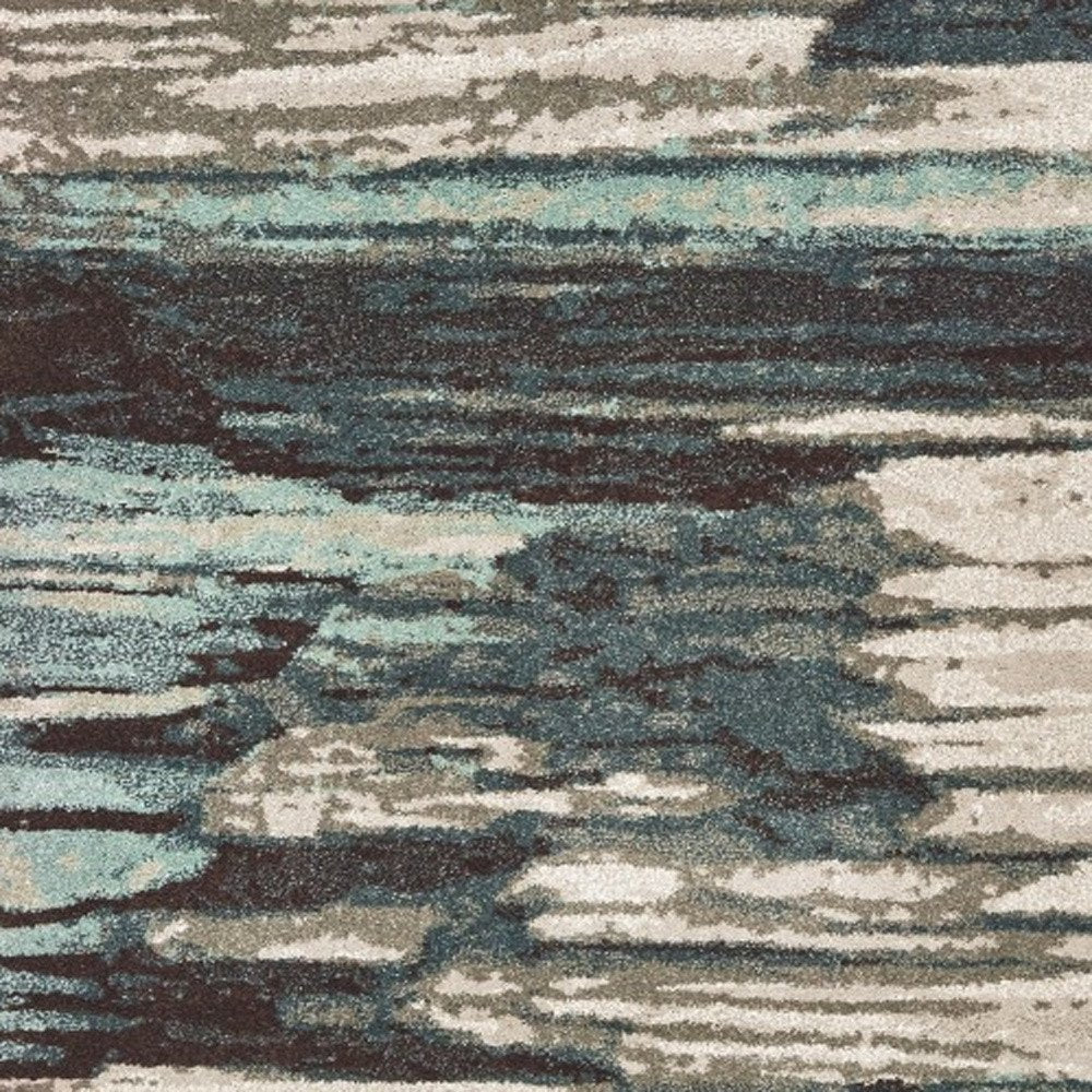 7' X 10' Ivory Blue And Gray Abstract Area Rug