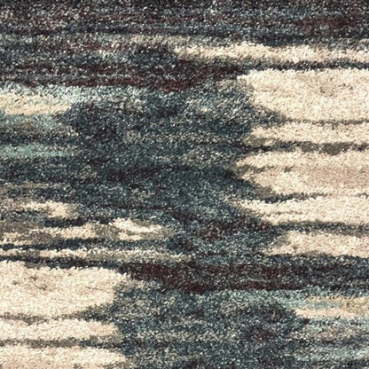 6' X 9' Ivory Blue And Gray Abstract Area Rug