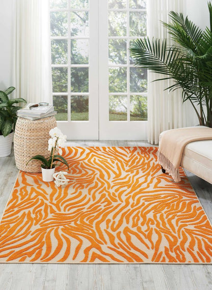 3' X 4' Orange And Ivory Abstract Indoor Outdoor Area Rug
