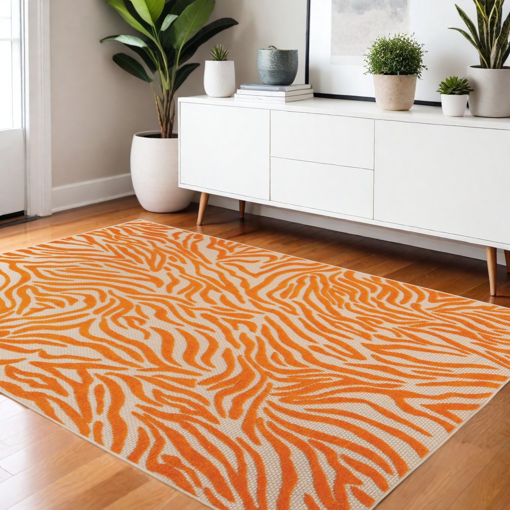 3' X 4' Orange And Ivory Abstract Indoor Outdoor Area Rug