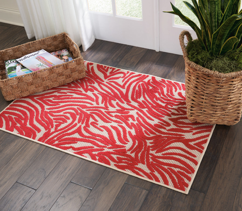 3' X 4' Orange And Ivory Abstract Indoor Outdoor Area Rug