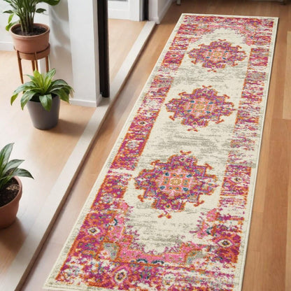 5' X 7' Ivory And Fuchsia Oriental Distressed Area Rug