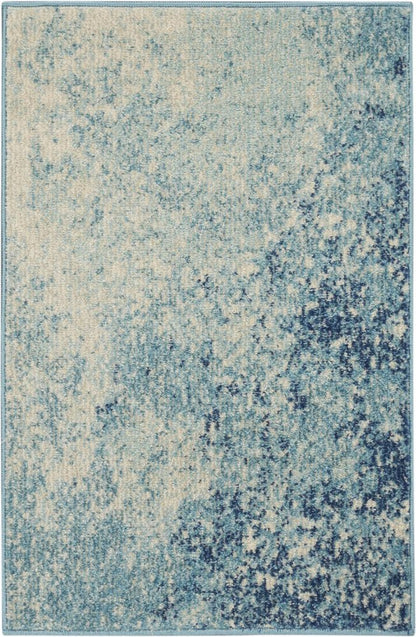 7' X 10' Blue And Ivory Abstract Area Rug