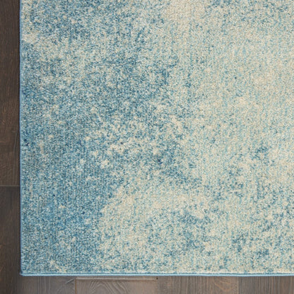 5' X 7' Blue And Ivory Abstract Area Rug