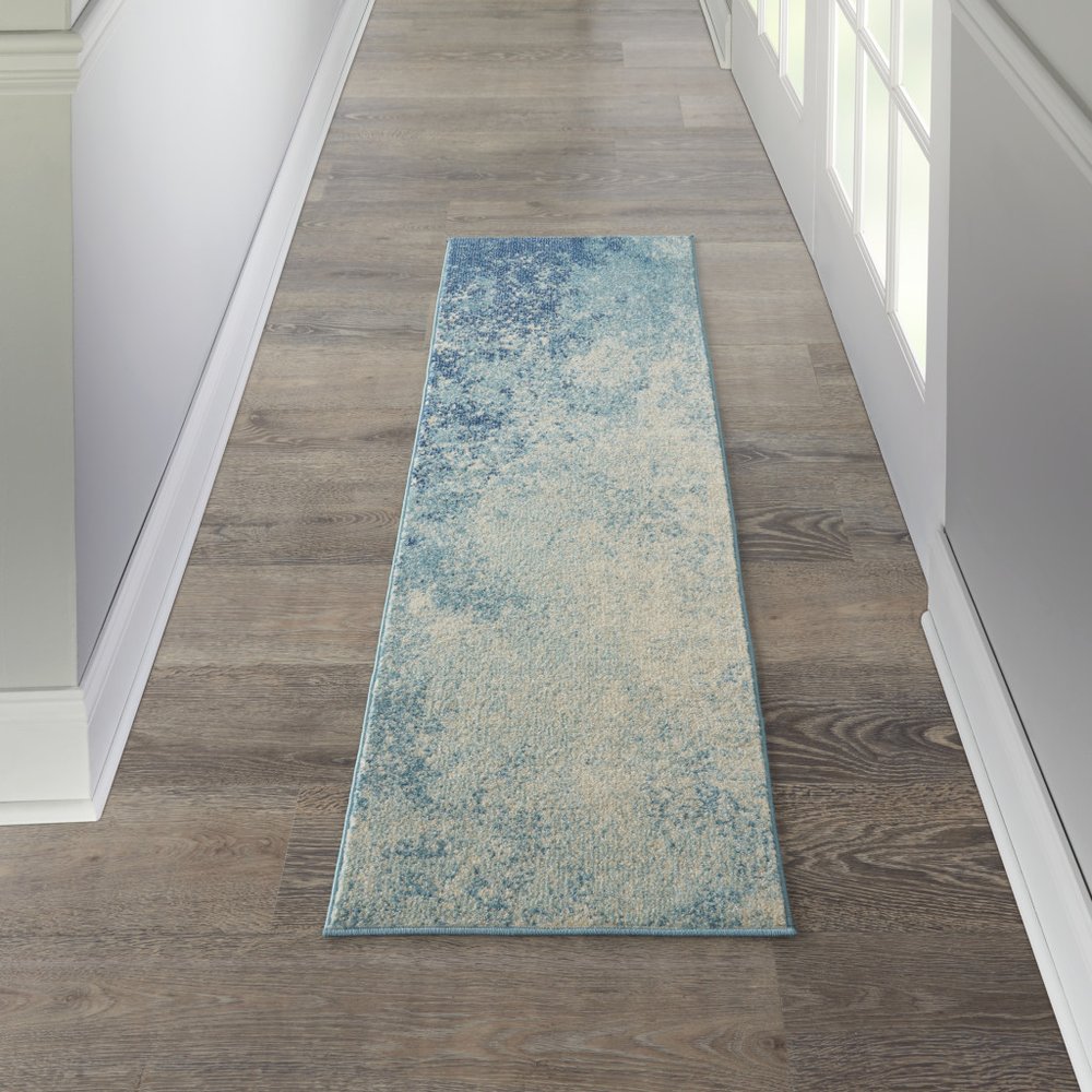 4' X 6' Blue And Ivory Abstract Area Rug