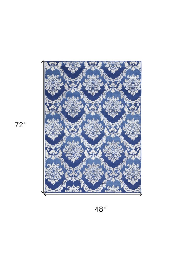 4' X 6' Ivory And Blue Damask Distressed Area Rug