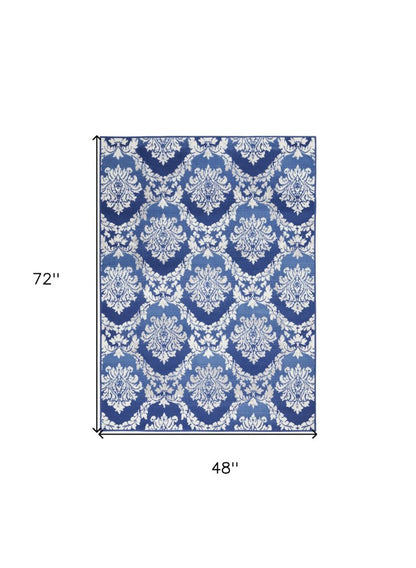 4' X 6' Ivory And Blue Damask Distressed Area Rug