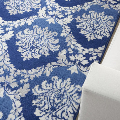 5' X 7' Blue And Ivory Damask Distressed Area Rug