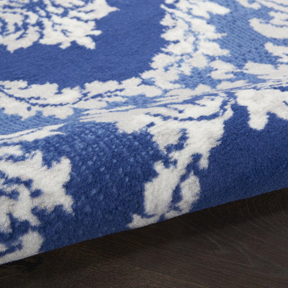5' X 7' Blue And Ivory Damask Distressed Area Rug