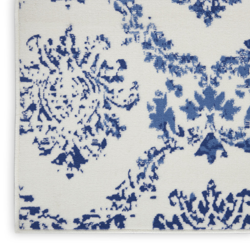 6' X 9' Blue And Ivory Damask Distressed Area Rug