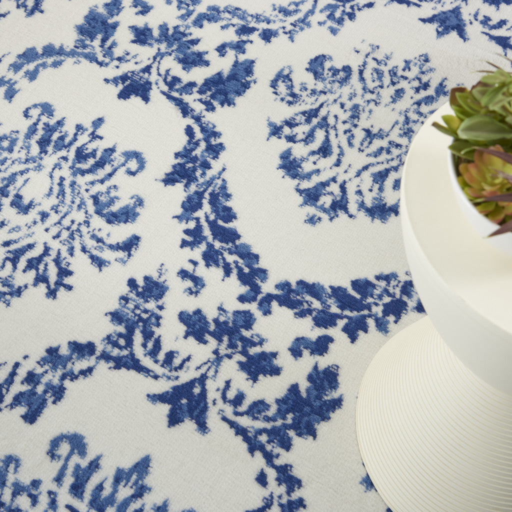 6' X 9' Blue And Ivory Damask Distressed Area Rug