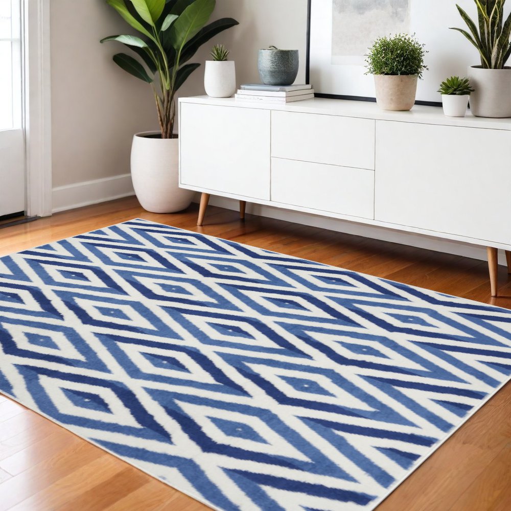 6' X 9' Ivory And Blue Geometric Area Rug