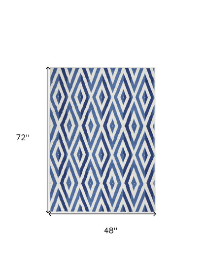 5' X 7' Blue And Ivory Geometric Dhurrie Area Rug