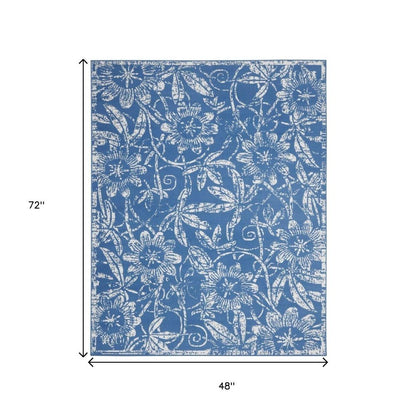 5' X 7' Blue And Ivory Floral Vines Distressed Area Rug