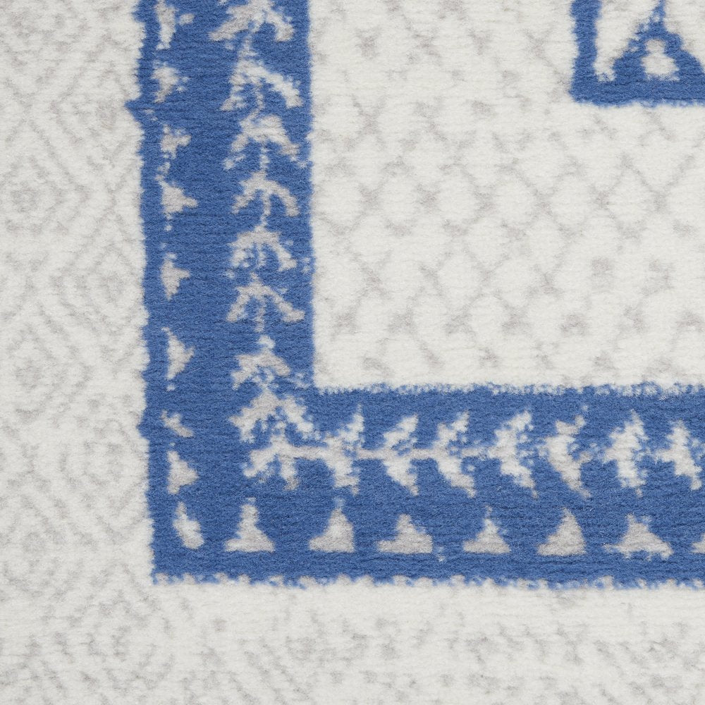 5' X 7' Ivory And Blue Ombre Distressed Area Rug