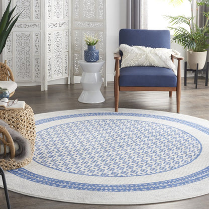 5' X 7' Ivory And Blue Ombre Distressed Area Rug