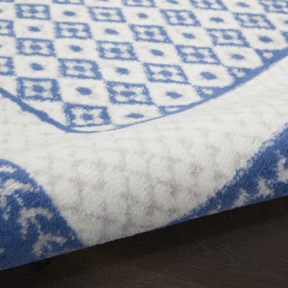 5' X 7' Ivory And Blue Ombre Distressed Area Rug