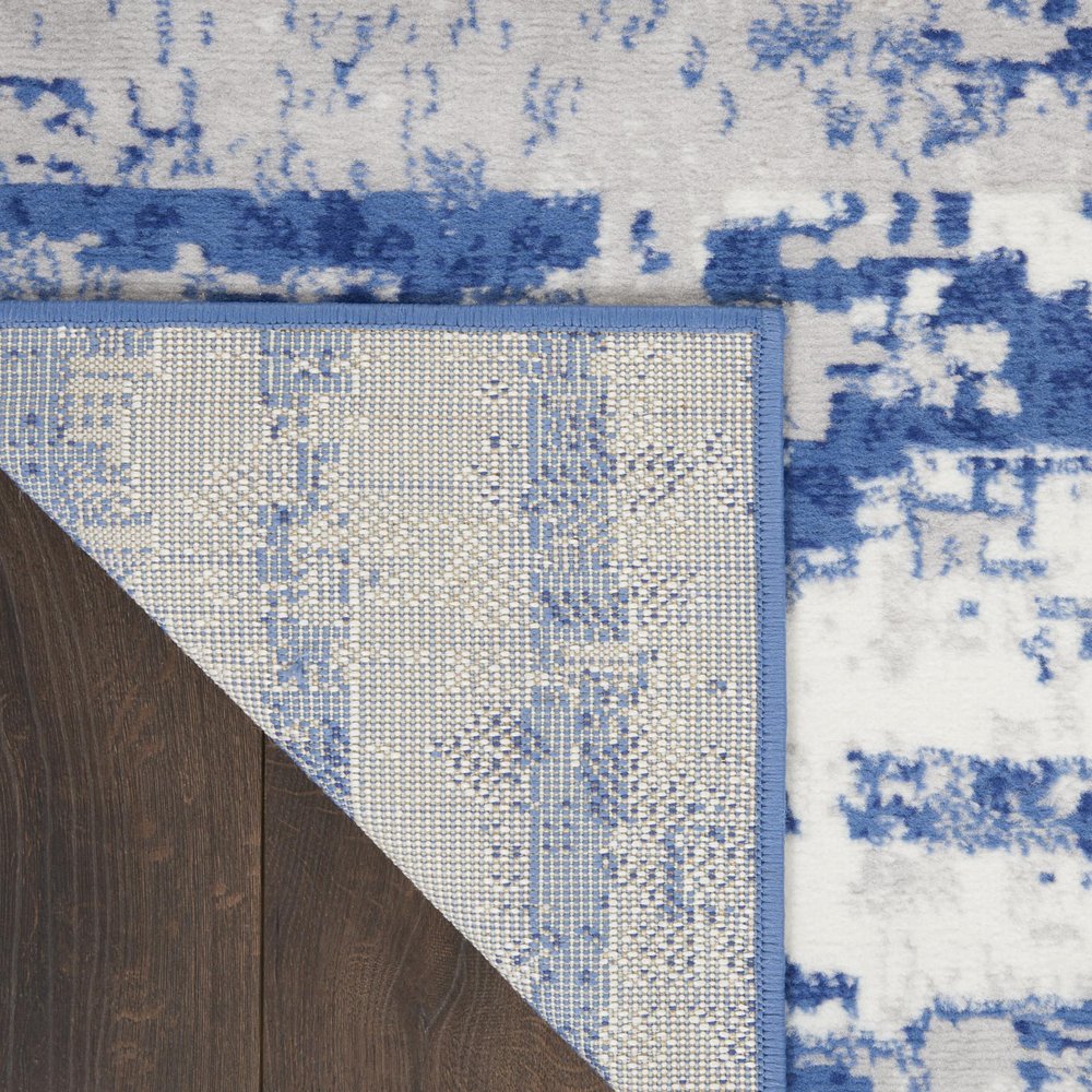 5' X 7' Ivory And Blue Ombre Distressed Area Rug