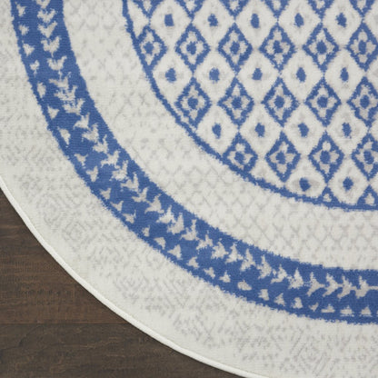 5' X 7' Ivory And Blue Ombre Distressed Area Rug