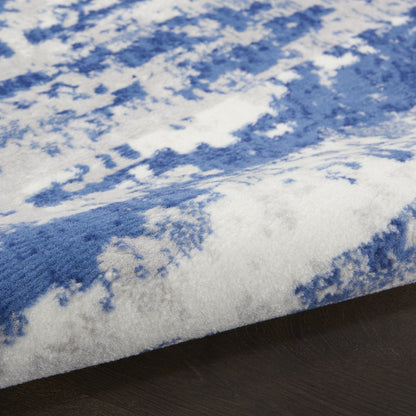 5' X 7' Ivory And Blue Ombre Distressed Area Rug