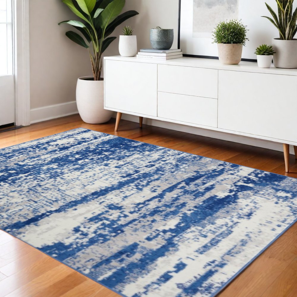 6' X 9' Ivory And Blue Ombre Distressed Area Rug