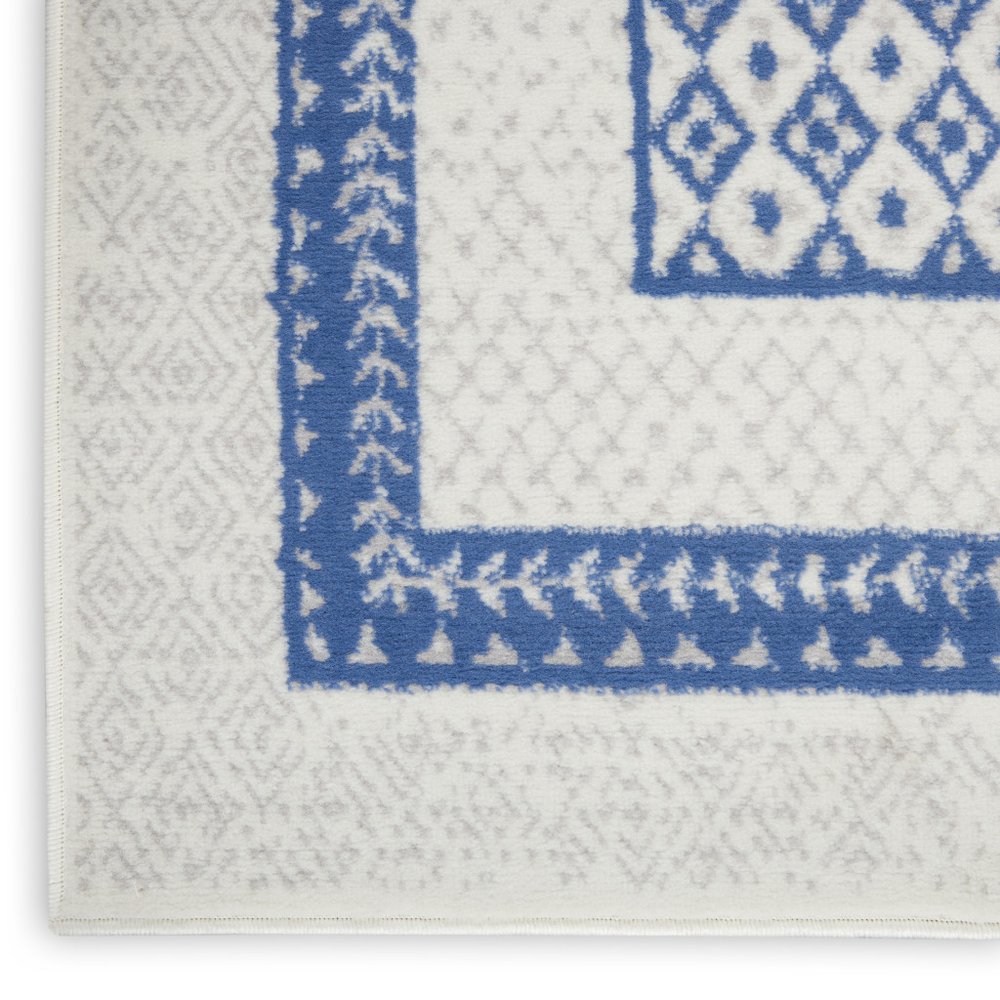 5' X 7' Ivory And Blue Ombre Distressed Area Rug