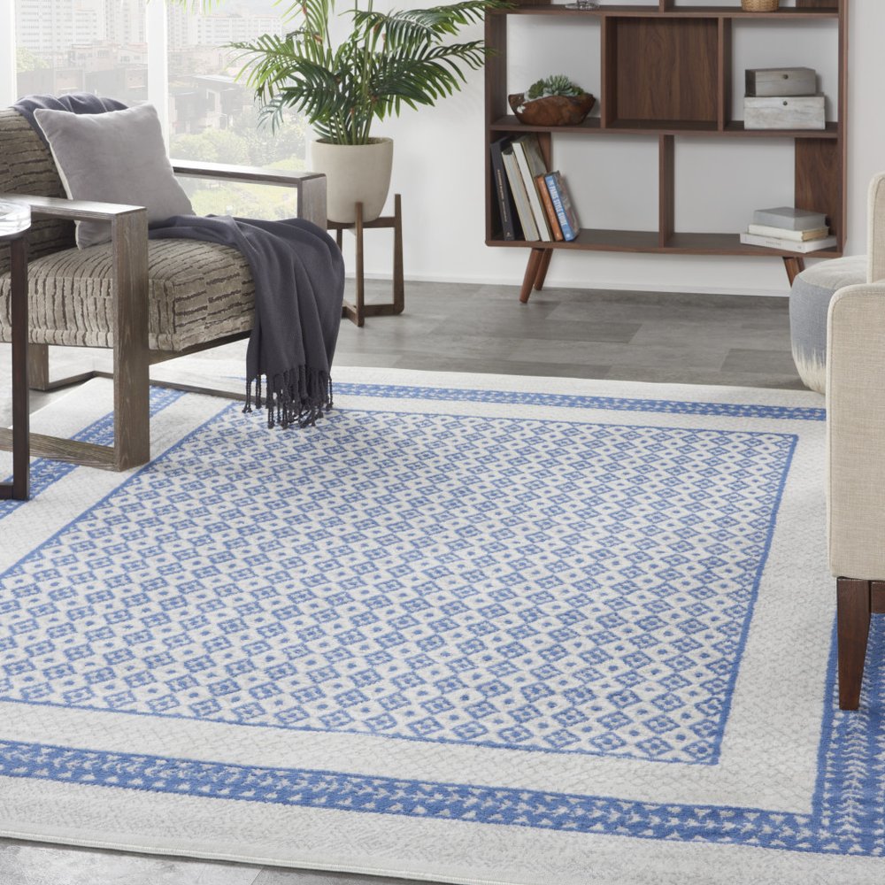 5' X 7' Ivory And Blue Ombre Distressed Area Rug