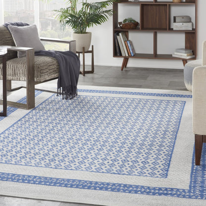 5' X 7' Ivory And Blue Ombre Distressed Area Rug