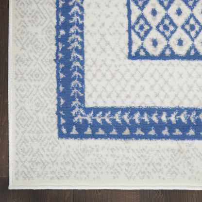 5' X 7' Ivory And Blue Ombre Distressed Area Rug