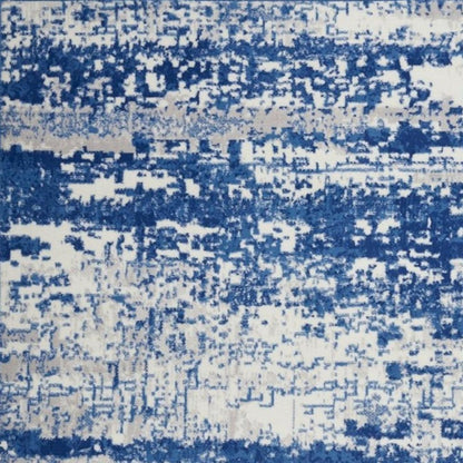 6' X 9' Ivory And Blue Ombre Distressed Area Rug