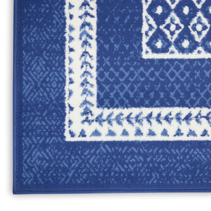 5' X 7' Ivory And Blue Ombre Distressed Area Rug