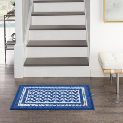 5' X 7' Ivory And Blue Ombre Distressed Area Rug