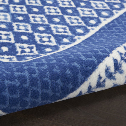 5' X 7' Ivory And Blue Ombre Distressed Area Rug