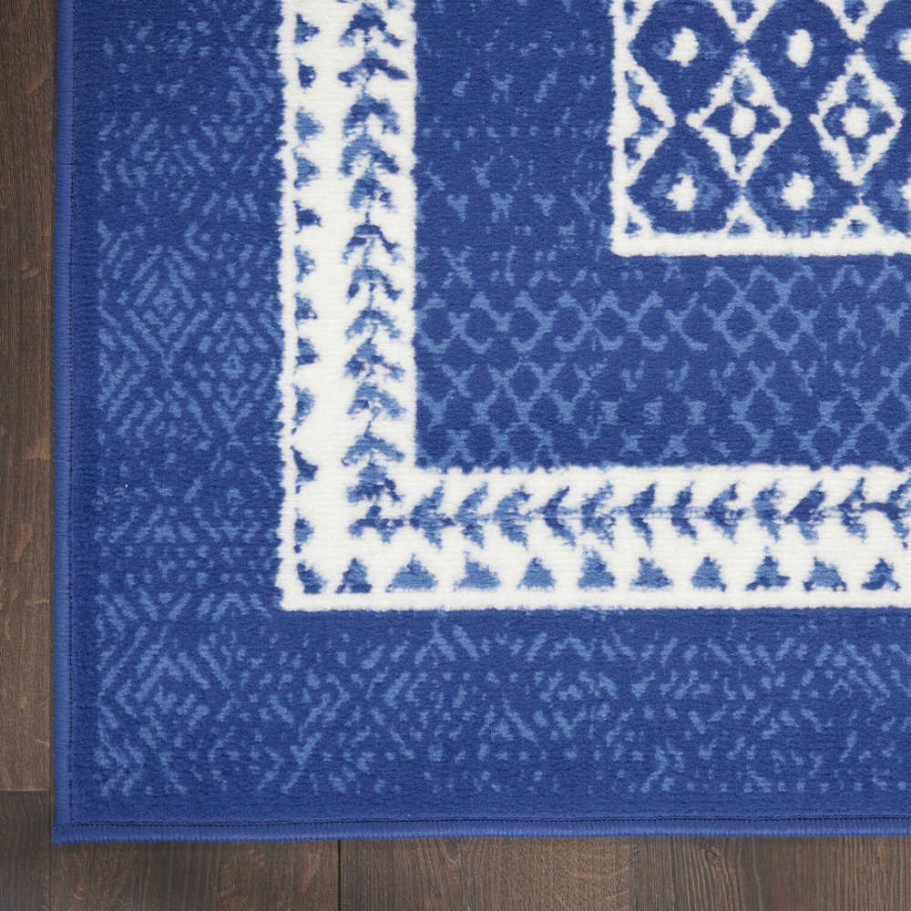 5' X 7' Ivory And Blue Ombre Distressed Area Rug