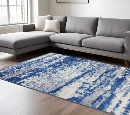 5' X 7' Ivory And Blue Ombre Distressed Area Rug