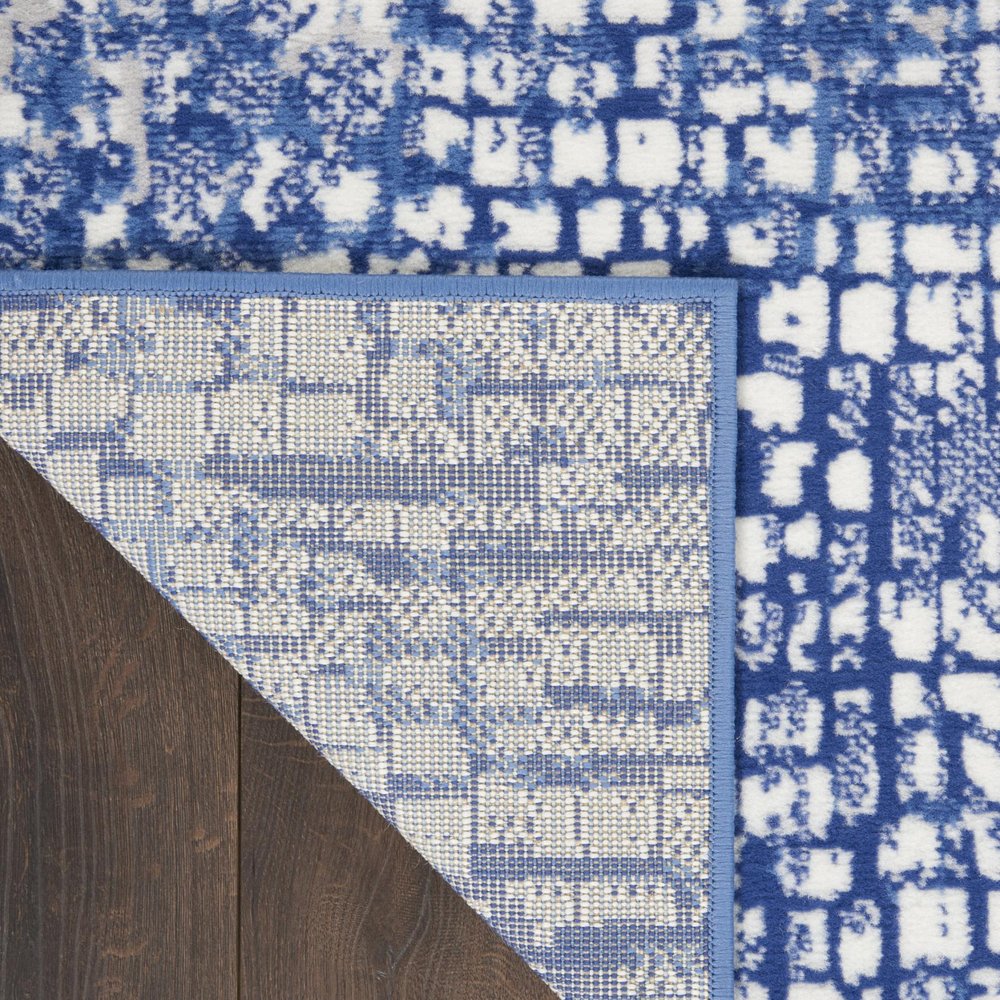 6' X 9' Ivory And Blue Geometric Area Rug